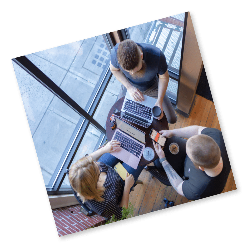 Three people working on laptops in coffee shop in Yakima Washington