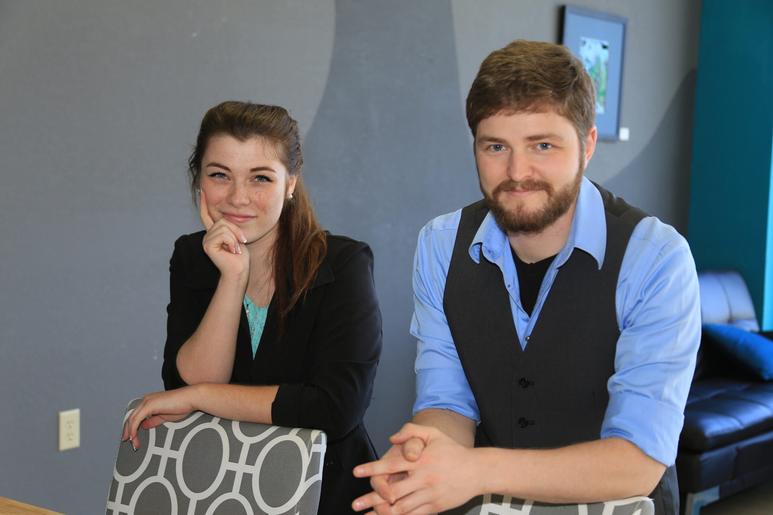 Leah and Skyler starting their Yakima website design company in a coworking space smiling