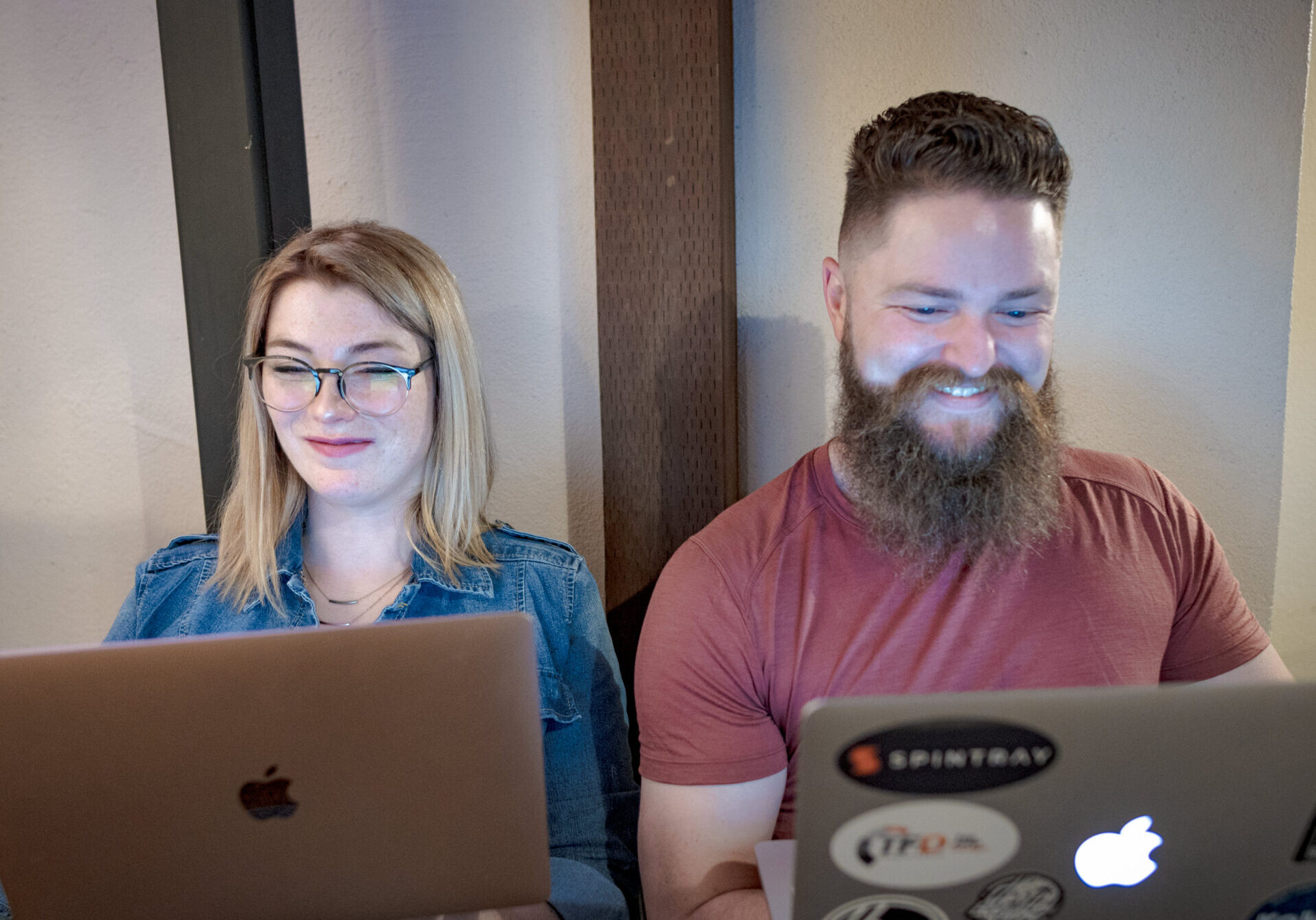 Skyler and Leah working on Yakima website design projects together and smiling